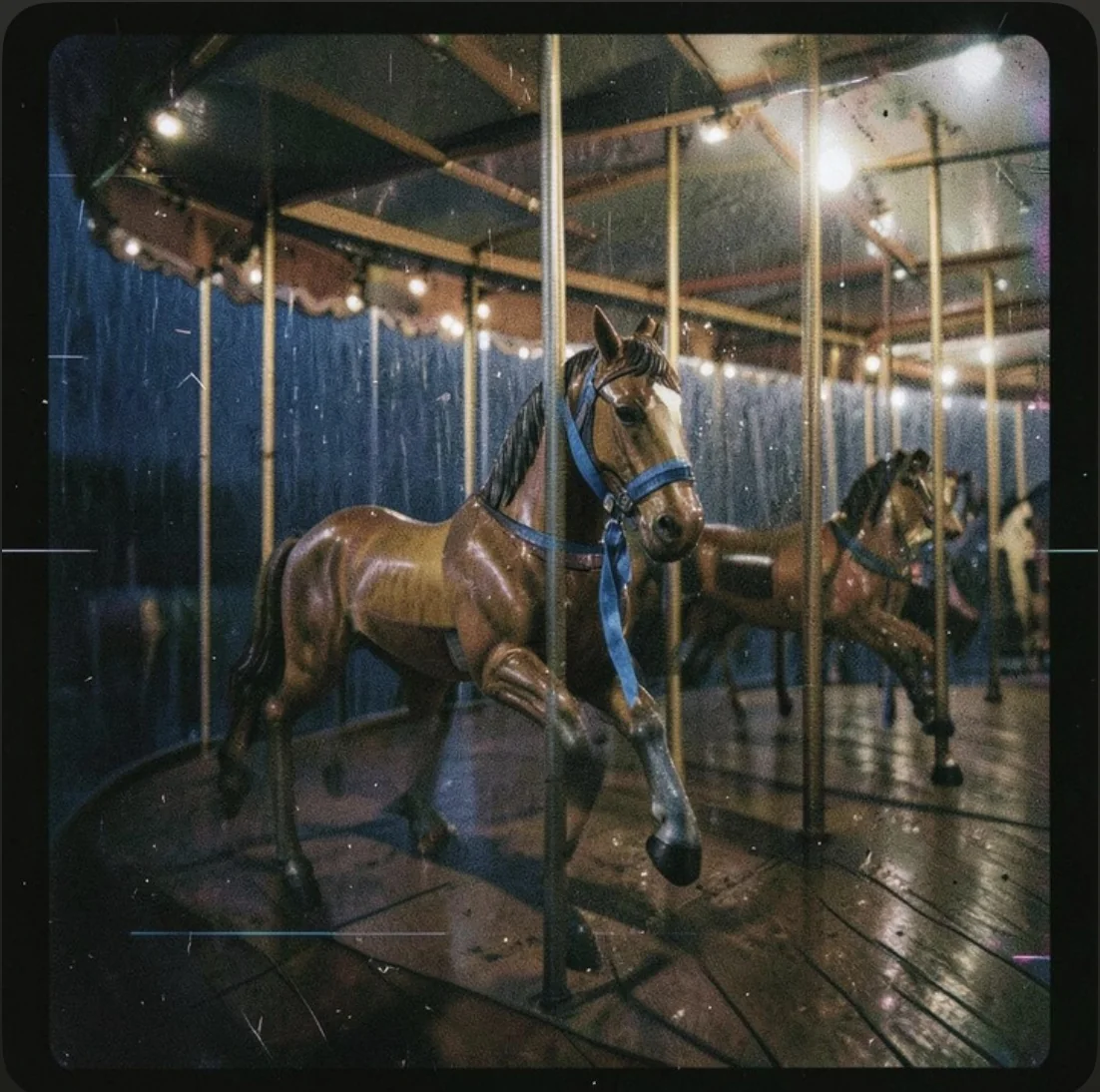 A weathered carousel horse wearing a blue rein, illuminated by old fairground bulbs